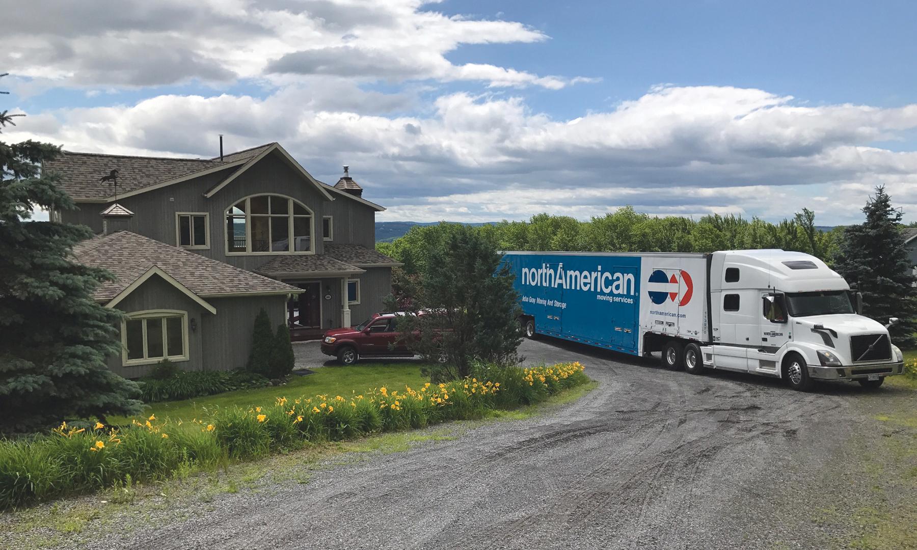 Our North American Van Lines truck parked in front of a house during a move.